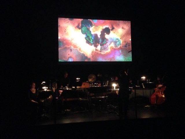 image from the dress rehearsal of Souvenir, Gregory Oh conducting